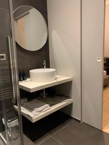a bathroom with a sink and a mirror at Spazio SIMA Space 2 - 2 in Milan