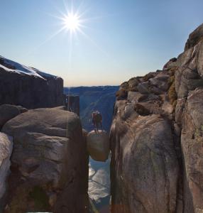 a horse standing on the edge of a cliff at Sirdalsvatnet Hotel in Tonstad