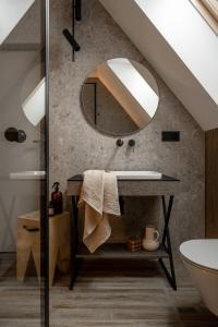 a bathroom with a sink and a mirror at Owce Dwie in Zakopane