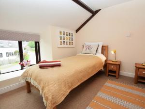 a bedroom with a bed and a window at 2 bed property in Gower 78344 in Reynoldston