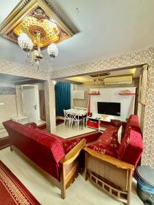 a living room with a couch and a dining room at İmmortal Hotel İstanbul in Istanbul