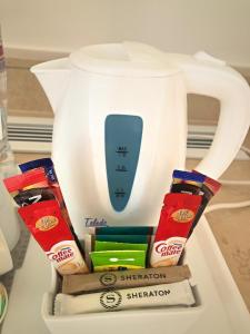 a tea kettle with packets of marshmallows at Sheraton Sharm Hotel, Resort, Villas & Spa in Sharm El Sheikh