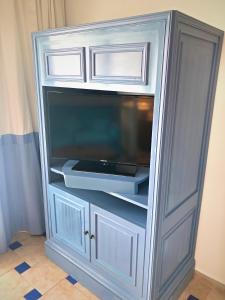 a blue cabinet with a microwave in it at Sheraton Sharm Hotel, Resort, Villas & Spa in Sharm El Sheikh