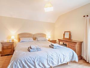 a bedroom with a bed with two towels on it at 1 bed property in Tretower Brecon Beacons BN126 in Tretower