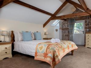 a bedroom with a bed with two towels on it at 1 Bed in Bwlch BN270 in Llansantffread