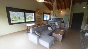 a living room with a couch and a table at La finca del Goño in Pravia