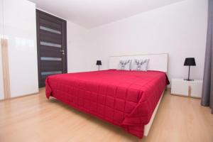 Posteľ alebo postele v izbe v ubytovaní Apartament Zacisze Tatr