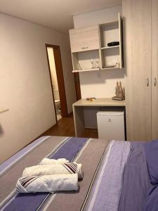 Ein Bett oder Betten in einem Zimmer der Unterkunft Flat - Suíte Trocadéro - 112
