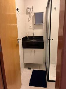 Ванная комната в Flat - Suíte Trocadéro - 112