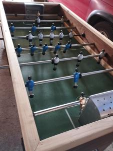 a wooden snooker table with six balls at Cabañas encanto de Chovellen in Pelluhue