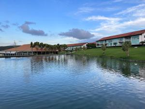 a large body of water in front of a building at Flat 414 Condominio Villa Hípica - Gravatá PE in Gravatá