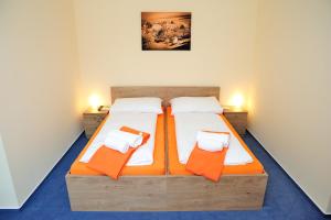 Posteľ alebo postele v izbe v ubytovaní Hotel Praha Potštejn