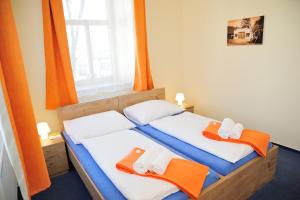 Posteľ alebo postele v izbe v ubytovaní Hotel Praha Potštejn