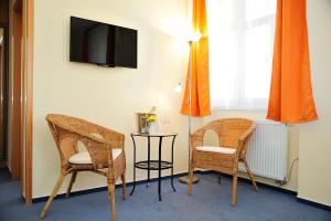 Televízia a/alebo spoločenská miestnosť v ubytovaní Hotel Praha Potštejn