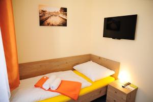 Posteľ alebo postele v izbe v ubytovaní Hotel Praha Potštejn
