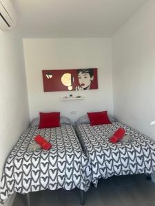 Posteľ alebo postele v izbe v ubytovaní Casa Carmen Ático Primera linea de playa