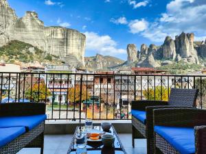 a view from the balcony of a hotel with mountains in the background at Meteora Scenic Loft in Kalabaka