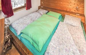 a couple of beds in a room at Amazing Apartment In Schetteregg With House A Mountain View in Egg