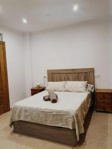 a bedroom with a bed with two towels on it at Dúplex Caminito de Ardales in Ardales