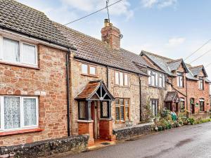 a row of brick houses on a street at 1 Bed in Washford 81240 in Washford