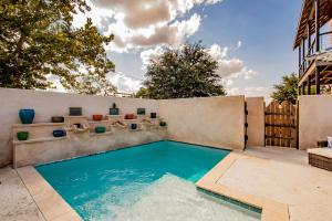 a swimming pool in the backyard of a house at GARDENS OF BARONS CREEK UNIT A in Fredericksburg