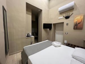 Una cama o camas en una habitación de Relais Ranieri