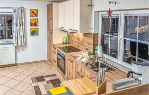 a kitchen with white cabinets and a sink at Awesome Apartment In Dalaas With 2 Bedrooms And Wifi in Dalaas