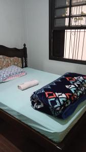 Giường trong phòng chung tại Pousada AME