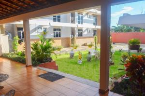 a view of a garden from the patio of a building at Pers Palace Hotel in Santa Inês