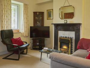 a living room with a couch and a fireplace at 3 bed in Keswick SZ422 in Applethwaite