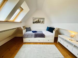 a bedroom with a bed in a attic at Ferienhaus Waterkant in Warnemünde