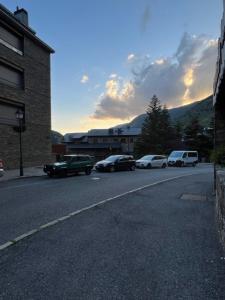 a group of cars parked on the side of a street at SINA - El Tarter in El Tarter