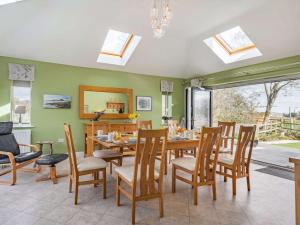a dining room with a table and chairs at 4 Bed in Manby 87031 in Manby