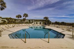 a large swimming pool with chairs around it at 304A Sea Cabin in Isle of Palms