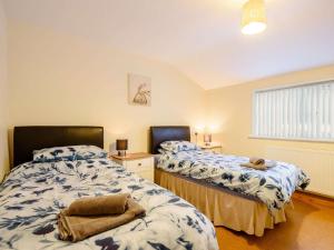 a bedroom with two beds and a window at 2 bed property in Bala North Wales 87274 in Llandderfel