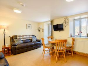 a living room with a couch and a table at 2 bed property in Bala North Wales 87274 in Llandderfel