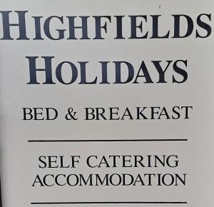 a sign that reads hospital holidays bed and breakfast and self catering accommodation at Boardman's Lodge in Peterborough