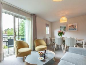 a living room with a table and chairs at 2 Bed in St. Mellion 87708 in St Mellion