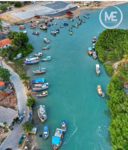an aerial view of a bunch of boats in a river at Mangue em flor in Maxaranguape