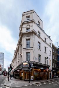 a white building on the corner of a street at (Covent Garden) Cozy Apartment Central London in London