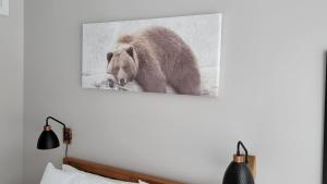 a picture of a brown bear on a wall at The Golden View - Luxury Cottage in La Conception