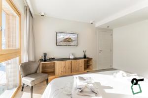 Postel nebo postele na pokoji v ubytování HOTIDAY Room Collection - Cervinia