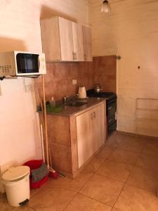 Kuchyň nebo kuchyňský kout v ubytování Cabañas El Chogüí