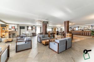 Posezení v ubytování HOTIDAY Room Collection - Cervinia