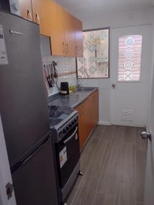 Η κουζίνα ή μικρή κουζίνα στο Arriendo diario Puertas del Mar, La Serena