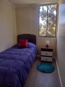 Ένα ή περισσότερα κρεβάτια σε δωμάτιο στο Arriendo diario Puertas del Mar, La Serena