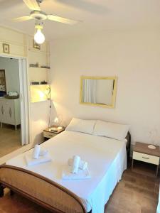 a bedroom with a bed with two towels on it at Porto Istana's house in Porto Istana