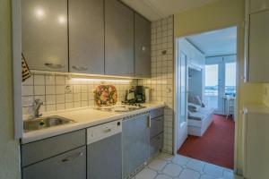 a kitchen with a sink and a counter top at Metropol-276 in Westerland