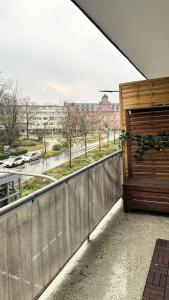 a balcony with a fence and a view of a street at Modern Studio - perfect location in Duisburg