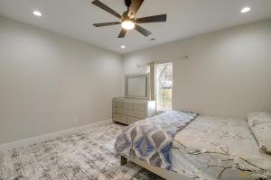 a bedroom with a bed and a ceiling fan at Modern and Pet-Friendly Home 3 Mi to Dtwn Knoxville in Knoxville